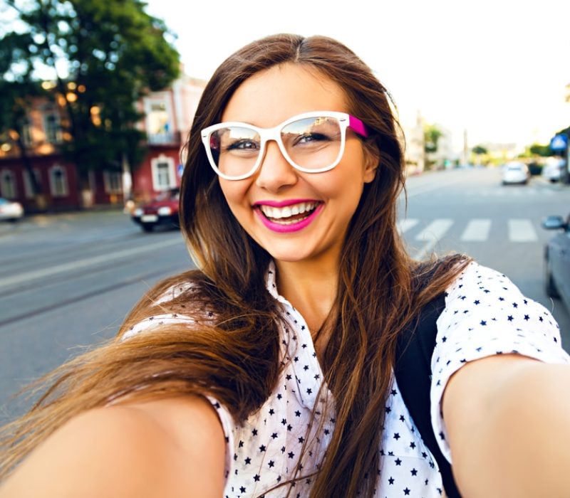 Young,Smiling,Teen,Happy,Woman,Making,Selfie,On,The,Street,